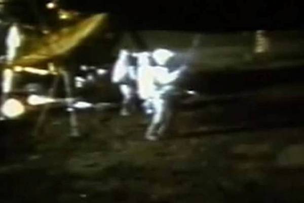 A shot from a video of Alan Shepard playing golf on the Moon.